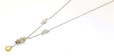 Lot 59 - A 9 carat white gold gem set necklace, the pendant of abstract ribbon bow design, set...
