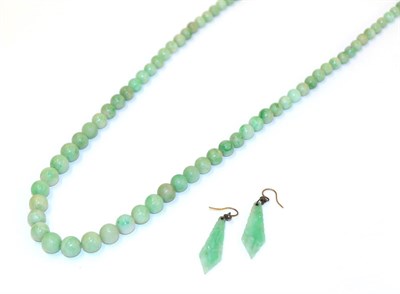 Lot 61 - A jade bead necklace, formed of one hundred and fifteen graduated spherical jade beads, length...
