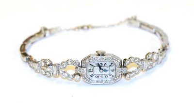 Lot 68 - A platinum Art Deco cocktail wristwatch, the rectangular dial within an eight-cut diamond set bezel