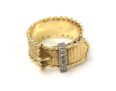 Lot 77 - A diamond belt and buckle ring, the yellow textured band with a reeded edge and a buckle motif...