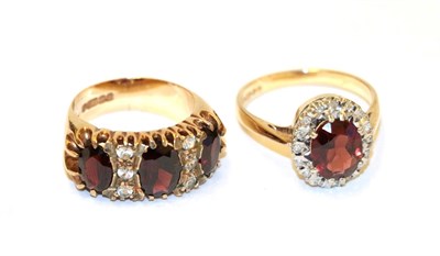 Lot 78 - A 9 carat gold garnet and white stone ring, three oval garnets with white stone accents, in...