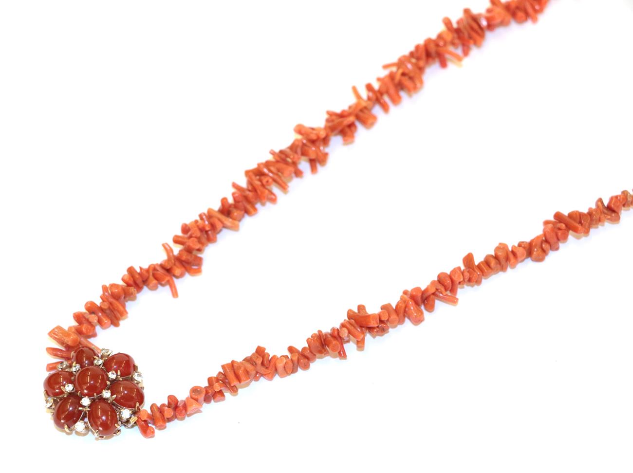 Lot 82 - A coral necklace, the branch coral knotted to a 9 carat gold chalcedony and white stone cluster...