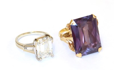 Lot 83 - A synthetic sapphire simulating alexandrite ring, the emerald-cut synthetic sapphire simulating...