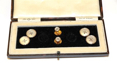 Lot 88 - A pair of mother-of-pearl cufflinks and two dress studs, of button design, cased   NB: Two...