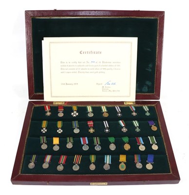 Lot 37 - A Commemorative Set of Thirty Four Rhodesian Miniature Medals and Awards, twenty seven in solid...