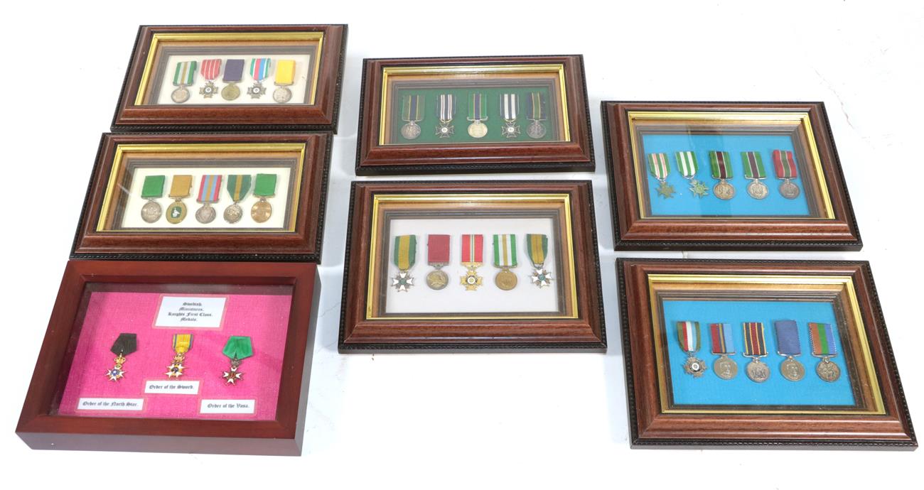 Lot 40 - A Collection of Miniature Medals, comprising:- thirty Rhodesian Medals contained in six small...