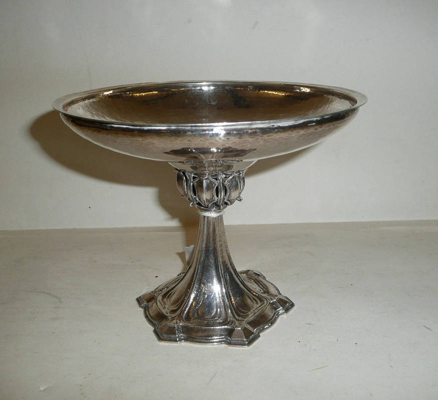 Lot 1569 - An Omar Ramsden Silver Tazza, the hammered textured shallow bowl, on cast stem, domed base, maker's