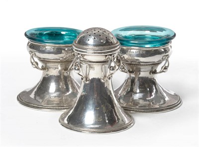 Lot 1570 - A Three Piece Silver Cruet, by Alwyn Carr, London 1926, of capstan form, hammered decoration,...