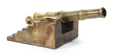 Lot 156 - A Victorian Brass Model of a Naval Cannon, the 23cm double banded barrel with various markings...