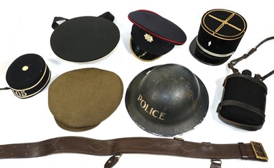 Lot 187 - A Second World War British Police Brodie Helmet, with dark blue finish and stencilled POLICE in...