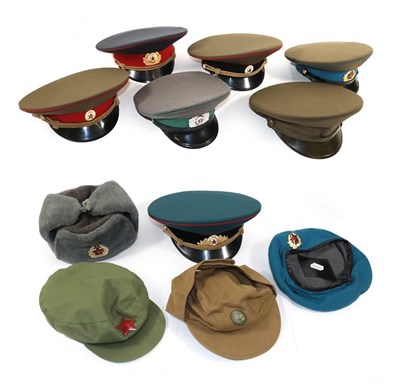Lot 198 - A Collection of Nine Various Soviet Russian Hats, comprising an Army Ushanka hat, an Army Artillery