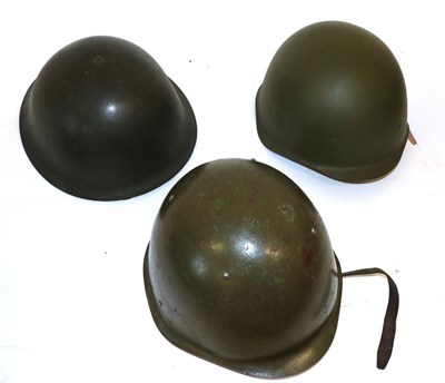 Lot 200 - A Second World War British Turtleshell Helmet, with elasticated webbing chinstrap and Lift the...