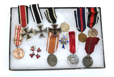 Lot 207 - A German Third Reich Iron Cross, second class; also, two First World War Iron Crosses, second...