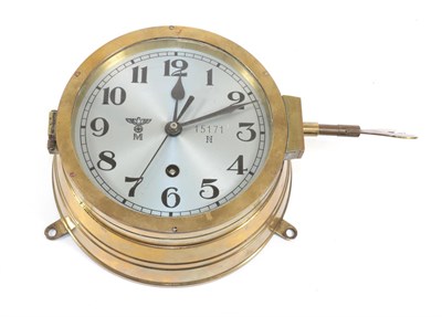 Lot 210 - A German Third Reich Kriegsmarine Bulk Head Clock, in a brass drum case, the 14.5cm circular...