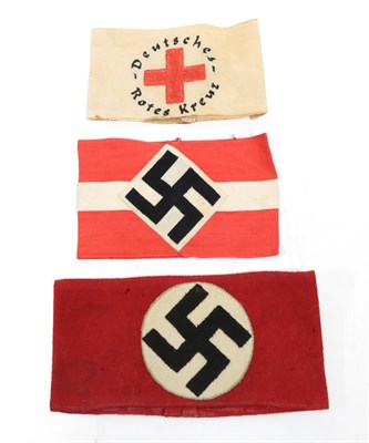 Lot 221 - A German Third Reich NSDAP Red Wool Armband, applied with a black wool swastika on a cream wool...