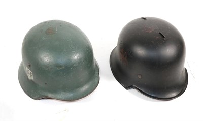 Lot 228 - A German Third Reich Fire Police Helmet, finished in black paint with later decals and slots...