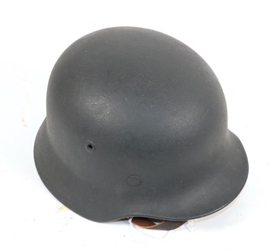 Lot 229 - A Copy of a German Third Reich M40 Army Helmet, with dark green/grey  'Rauhlack' finish,...