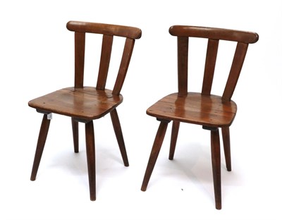 Lot 235 - A Pair of German Third Reich Kreigsmarine Chairs, in beech, with curved cresting rails, triple slat