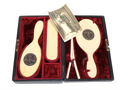 Lot 241 - A Copy of a German Third Reich SS Ivorine Vanity Set, comprising a hair brush and hand mirror, each