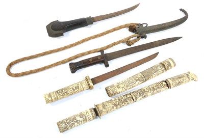 Lot 253 - Two 19th Century Japanese Aikuchi, each with single edge steel blade and sectional bone grip...
