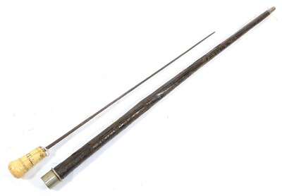 Lot 291 - An 18th Century Swordstick, the 58cm tapering diamond section steel blade engraved with scrolls...