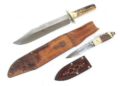 Lot 306 - A 20th Century Bowie Knife, the 26cm clip point steel blade laser etched George Wolstenholm &...