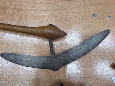 Lot 316 - A 20th Century Zulu War Axe, the 39cm crescent shape blade with cylindrical tang inserted into...