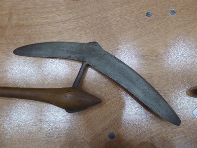 Lot 316 - A 20th Century Zulu War Axe, the 39cm crescent shape blade with cylindrical tang inserted into...