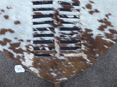 Lot 328 - Two 20th Century Zulu Cow Hide Shields, each of tan and white colouring, of elliptical form,...