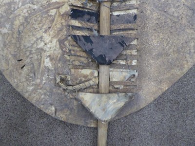 Lot 328 - Two 20th Century Zulu Cow Hide Shields, each of tan and white colouring, of elliptical form,...