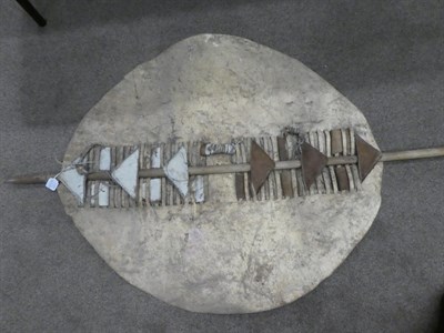 Lot 329 - Two 20th Century Zulu Cow Hide Shields, each of tan and white colouring, of elliptical form,...