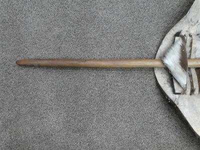 Lot 329 - Two 20th Century Zulu Cow Hide Shields, each of tan and white colouring, of elliptical form,...