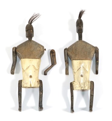 Lot 343 - A Pair of Early 20th Century African Fertility Dolls, each with plug-in dark hardwood head with...