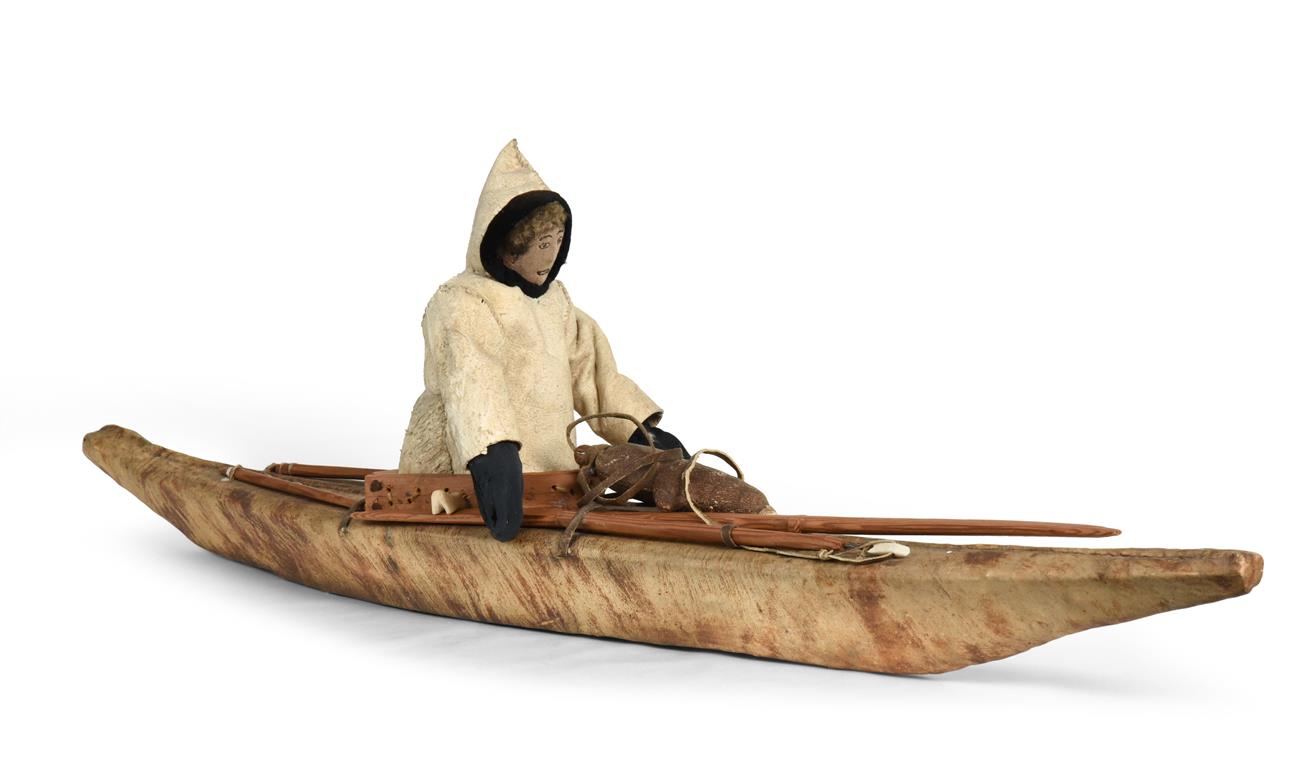 Lot 344 - An Early 20th Century Inuit Model One Man Kayak, the wood frame covered in stretched scraped...