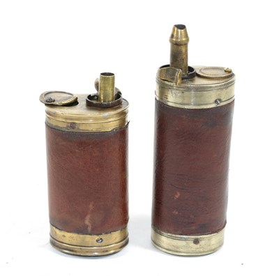 Lot 354 - A Brass Combination Pistol Flask, of oval section, with external steel spring, baluster knopped...