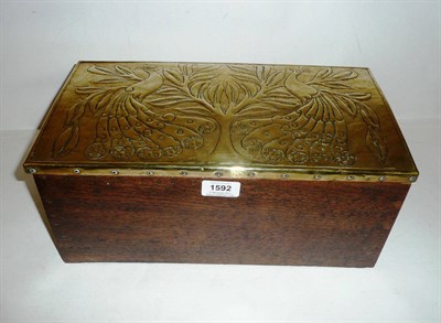 Lot 1592 - An Arts & Crafts Oak Hinged Box, with riveted brass covered lid embossed with two stylised...