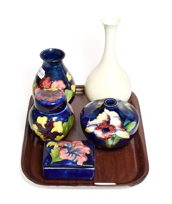 Lot 148 - A William Moorcroft vase, 21.5cm (crazed) an Orchid pattern light fitment, 10cm and three...