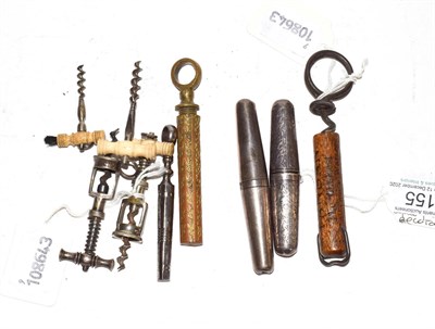 Lot 155 - Four miniature corkscrews, three with carved bone handles, together with a silver-handled...