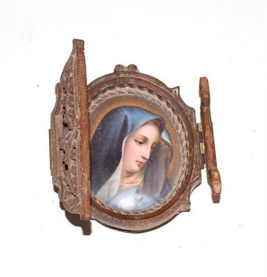 Lot 176 - A 19th century painted porcelain portrait miniature of the Virgin Mary, unsigned, within a...