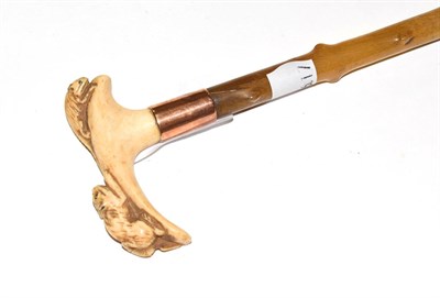 Lot 199 - A late 19th century rhinoceros horn lady's riding crop, the curved bone handle intricately...