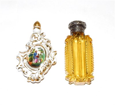 Lot 213 - An amber coloured glass scent-bottle with silvered mount, tapering, the cut-glass body with foliage