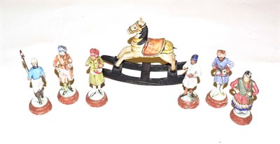 Lot 216 - A small group of mid-19th century painted plaster Indian figures