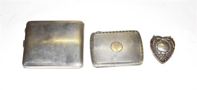 Lot 228 - A silver cigarette case, W.N. Ltd, Birmingham 1928; with another; and a silver heart-shaped...