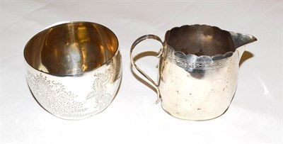 Lot 231 - A George III silver cream-jug, London 1795 and a Victorian silver sugar-basin, London 1888, 9oz (2)