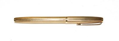 Lot 235 - A 9 carat gold ballpoint pen, with engine turned decoration throughout, length 12.5cm