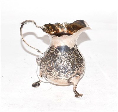 Lot 240 - A George II silver cream jug, by Isaac Cookson, Newcastle, 1751, pear-shaped and on three pad feet