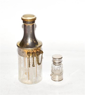 Lot 252 - A silvered metal mounted glass four section scent bottle, tapering, the glass body engraved...