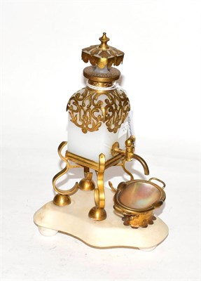 Lot 253 - A brass mounted opaline glass scent decanter, the bottle of square section and with openwork...