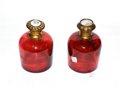 Lot 264 - Two brass-mounted cranberry-glass scent-bottles, each tapering, with differing hinged cover,...