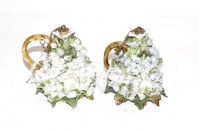 Lot 265 - Two porcelain scent-bottles, each tapering, applied with flowers and foliage in high relief and...